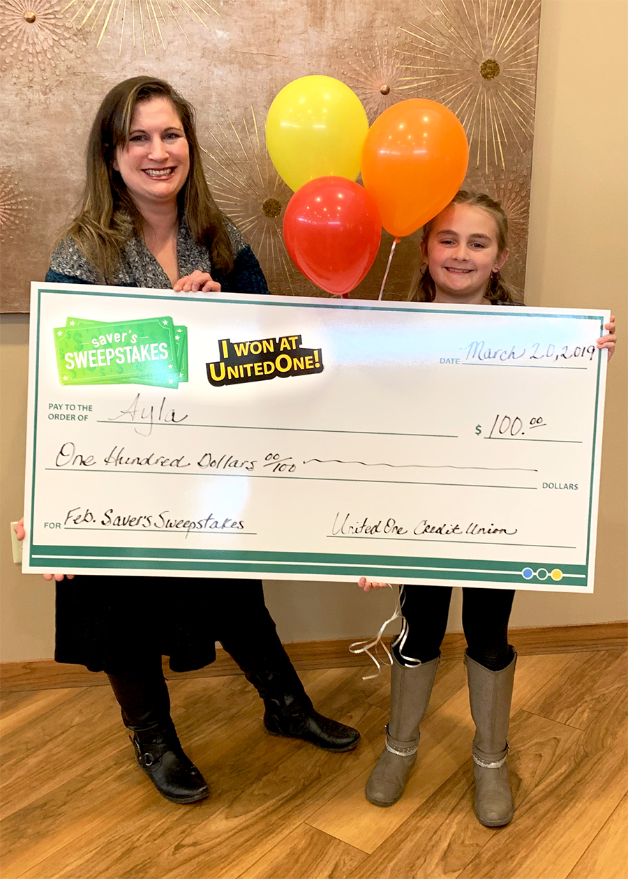 Saver's Sweepstakes winner Ayla with Member Service Representative
